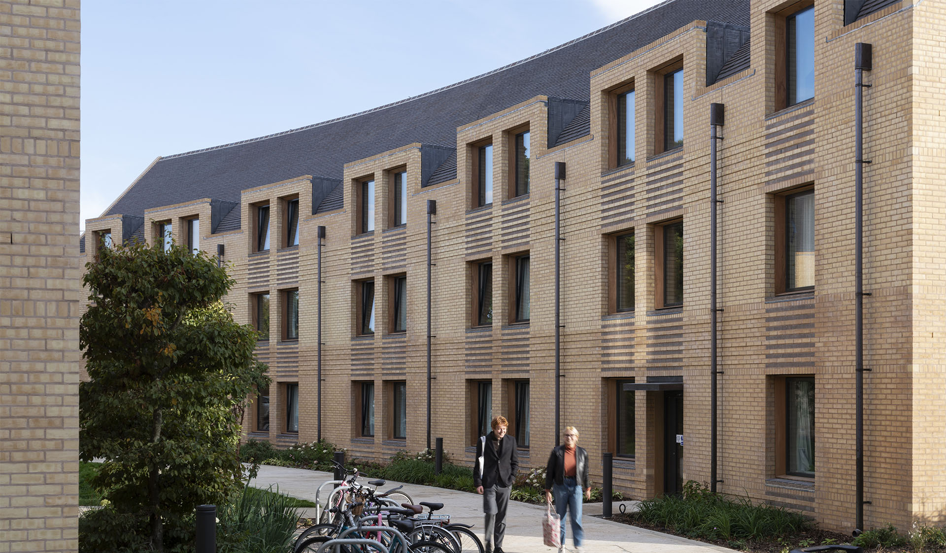 curved terrace at Croft Gardens Kings College Cambridge with Dreadnought Staffs blue handmade clay roof tiles